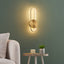 SUBA oval brass wall light